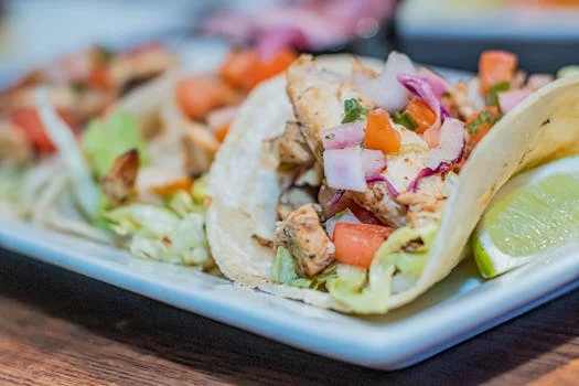 chicken tinga tacos with avocado salsa