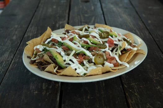 loaded nachos with guacamole sour cream jalapeños