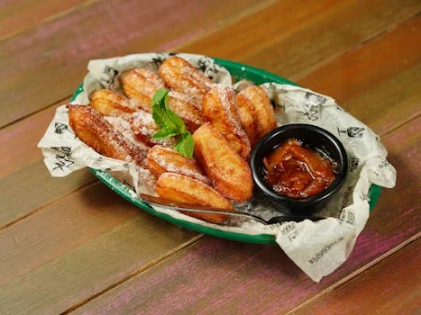golden churros with cinnamon sugar chocolate dipping sauce